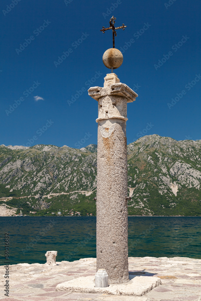 Cross on the island of Lady of the Rocks. Bay of Kotor
