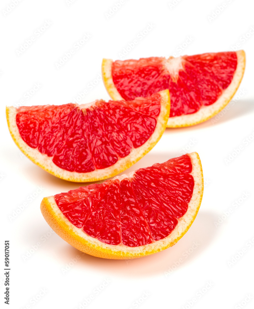 cut red grapefruit isolated on white cut red grapefruit isolated on white