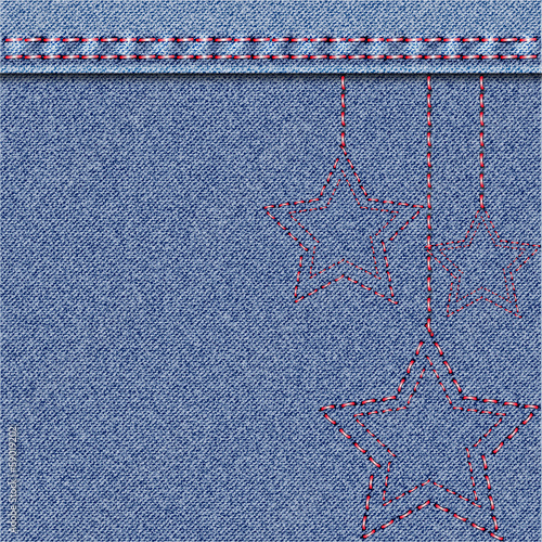 Denim Christmas background with embroidery.