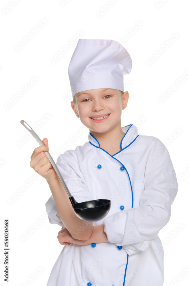 Smiling young chef with ladle Smiling young chef with ladle