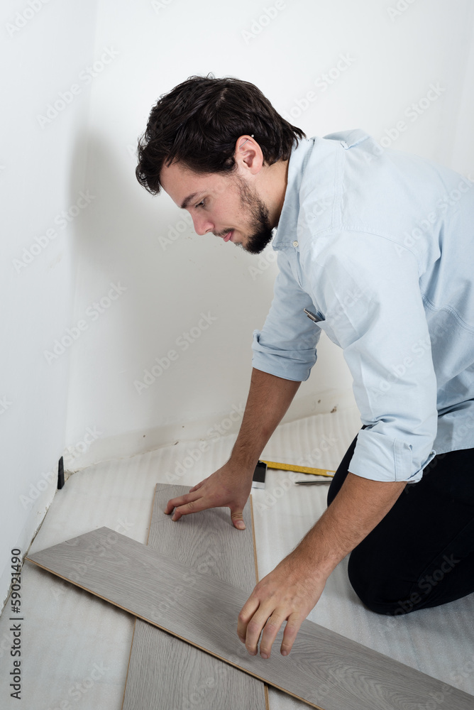 young man bricolage working young man bricolage working