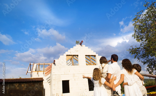 Family building a new house photo