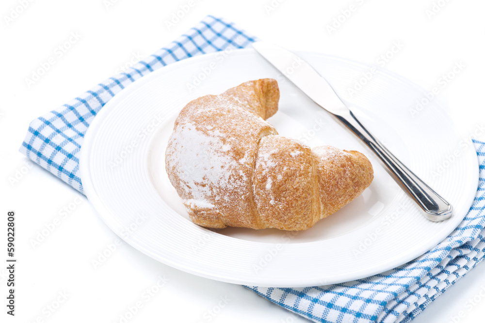 croissant and a knife, isolated croissant and a knife, isolated