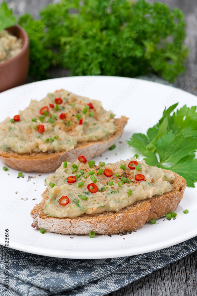 pate of white beans with spices on bread, vertical