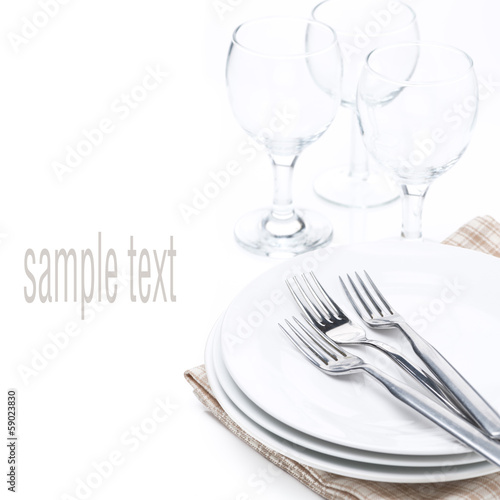 tableware for dinner - plates, forks and glasses, isolated