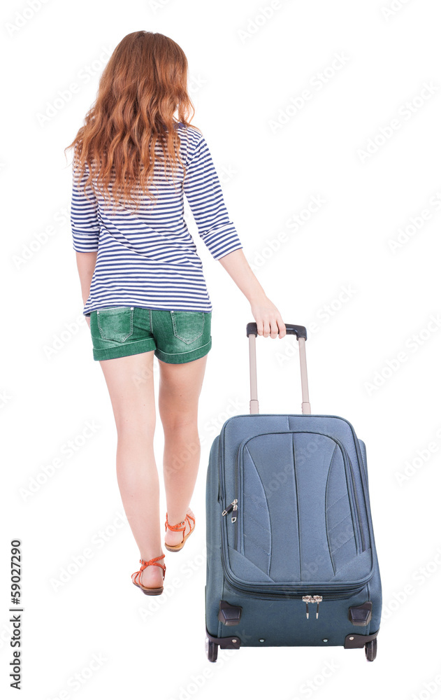 back view of walking woman with suitcase back view of walking woman with suitcase