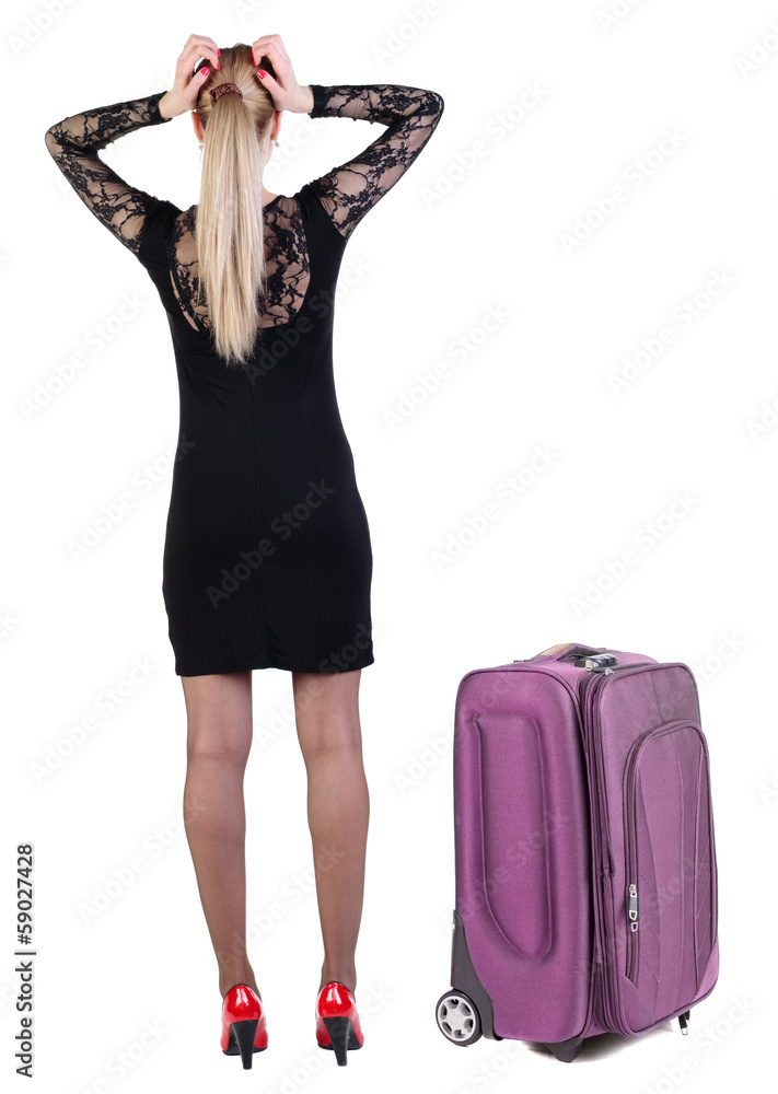 Back view of shocked business woman in dress traveling with suit Back view of shocked business woman in dress traveling with suit