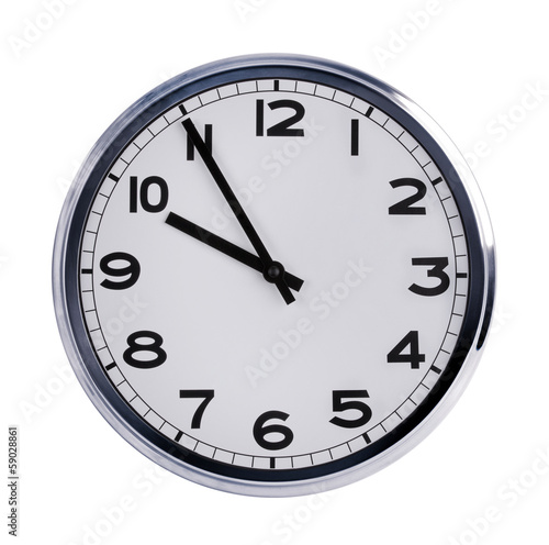 Round office clock shows ten o'clock