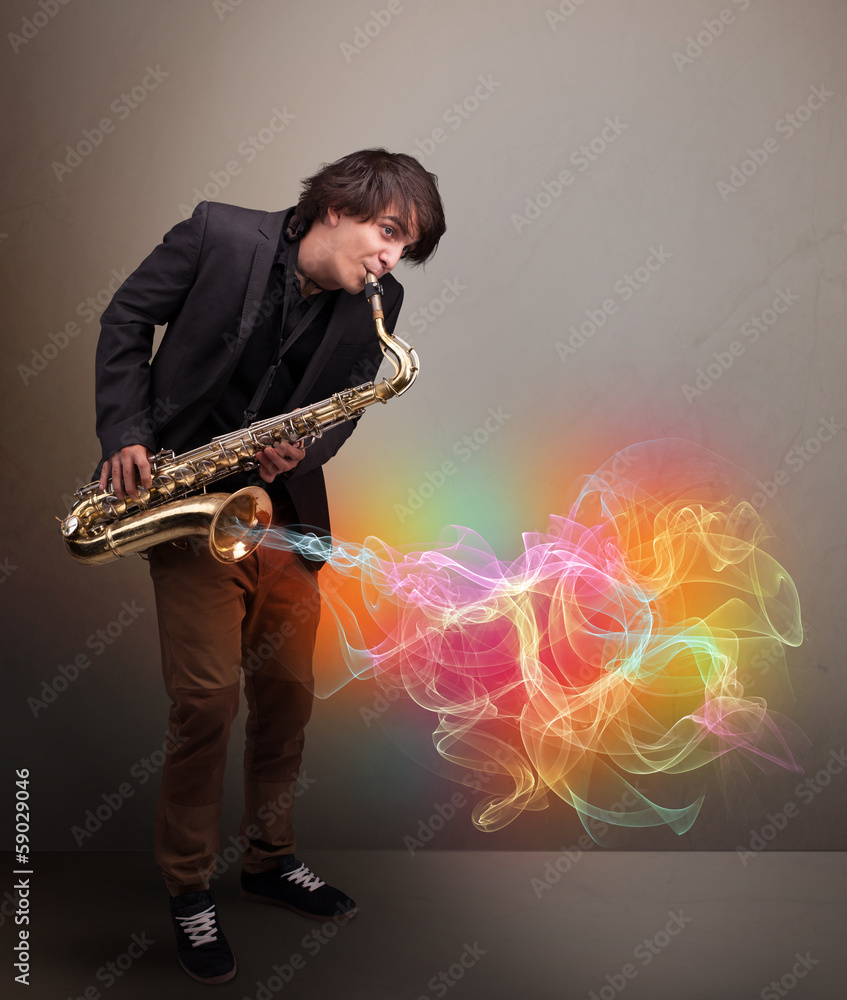 Naklejka premium Attractive musician playing on saxophone with colorful abstract
