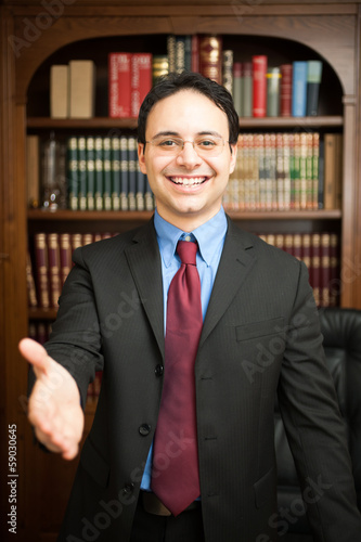 Canvas Print Businessman giving an handshake