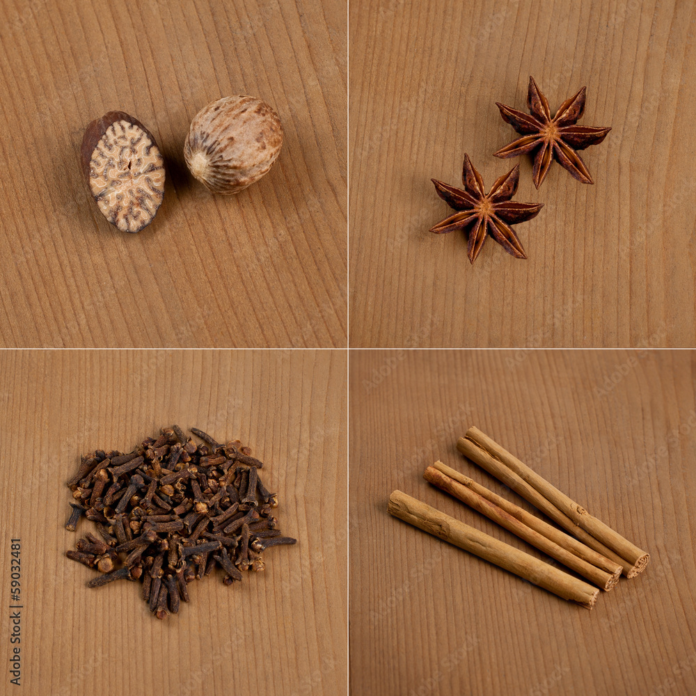 Cinnamon, nutmeg, cloves, a banyan on wooden board Cinnamon, nutmeg, cloves, a banyan on wooden board
