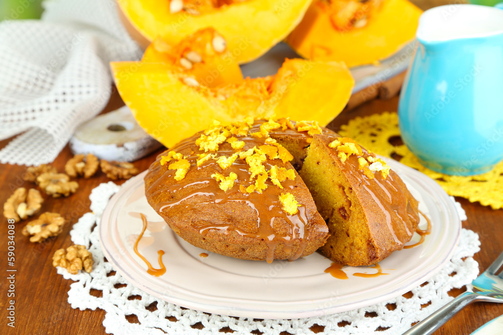 Delicious pumpkin pie on plate on wooden table close-up Delicious pumpkin pie on plate on wooden table close-up