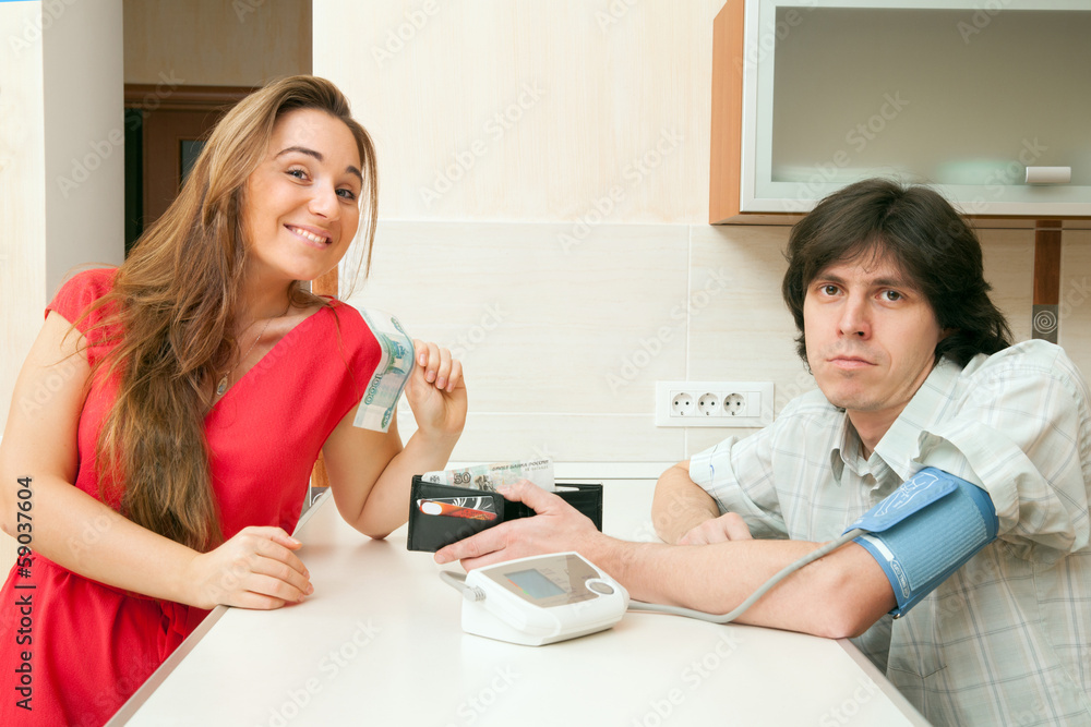 The young girl takes away money from a wallet of the patient The young girl takes away money from a wallet of the patient