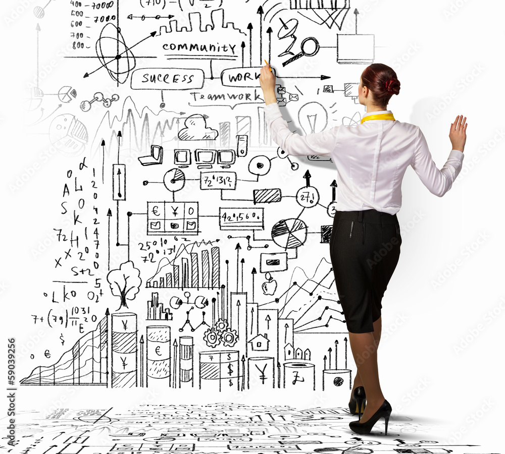 Businesswoman drawing on wall Businesswoman drawing on wall