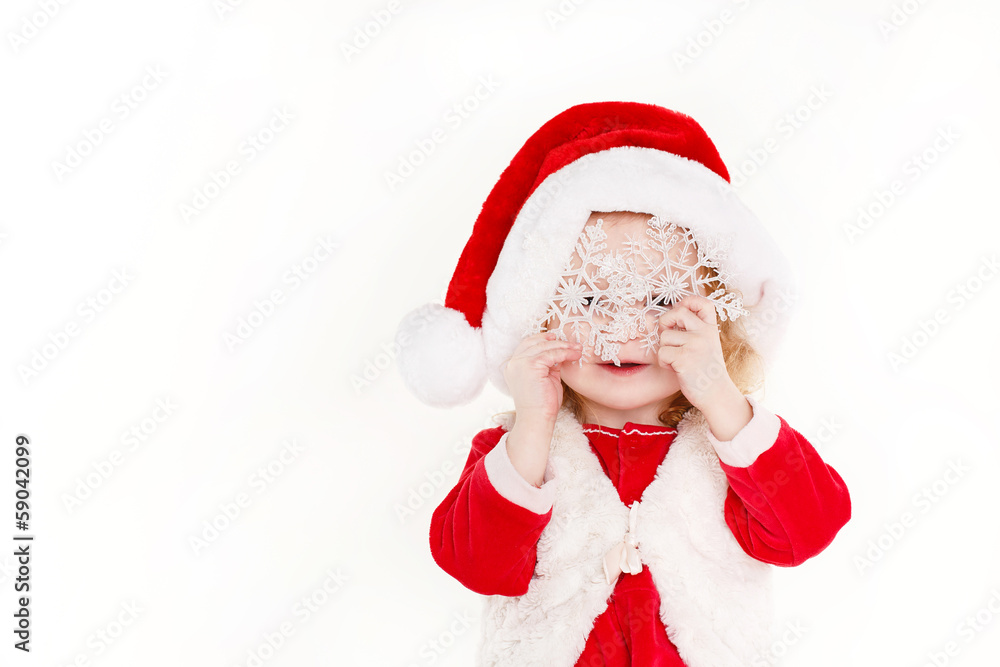 little girl in a cap of Santa Claus isolated on white background little girl in a cap of Santa Claus isolated on white background