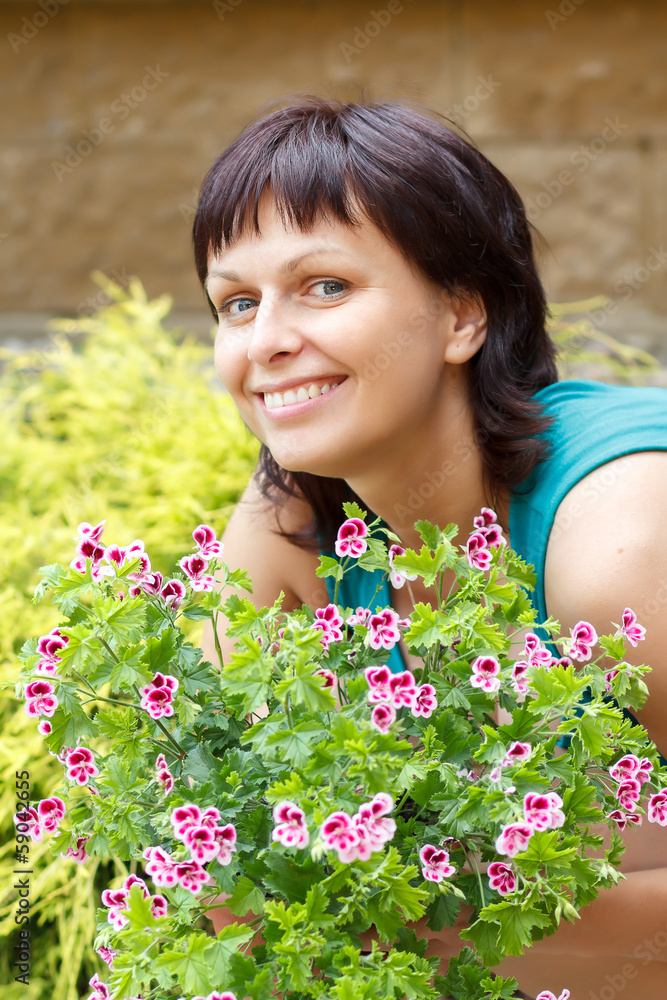 happy smiling middle age woman gardening happy smiling middle age woman gardening