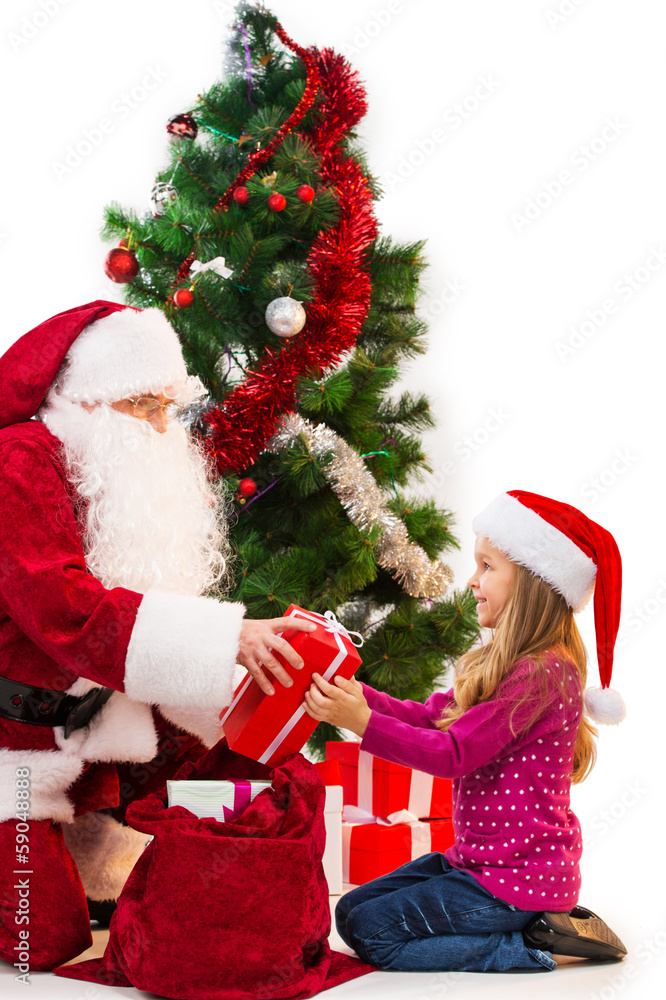 Santa Claus in red costume giving present from the bag. Santa Claus in red costume giving present from the bag.