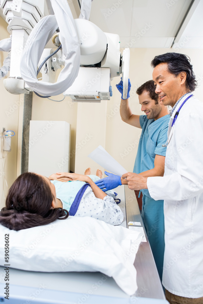 Medical Team Preparing Patient For Xray Medical Team Preparing Patient For Xray