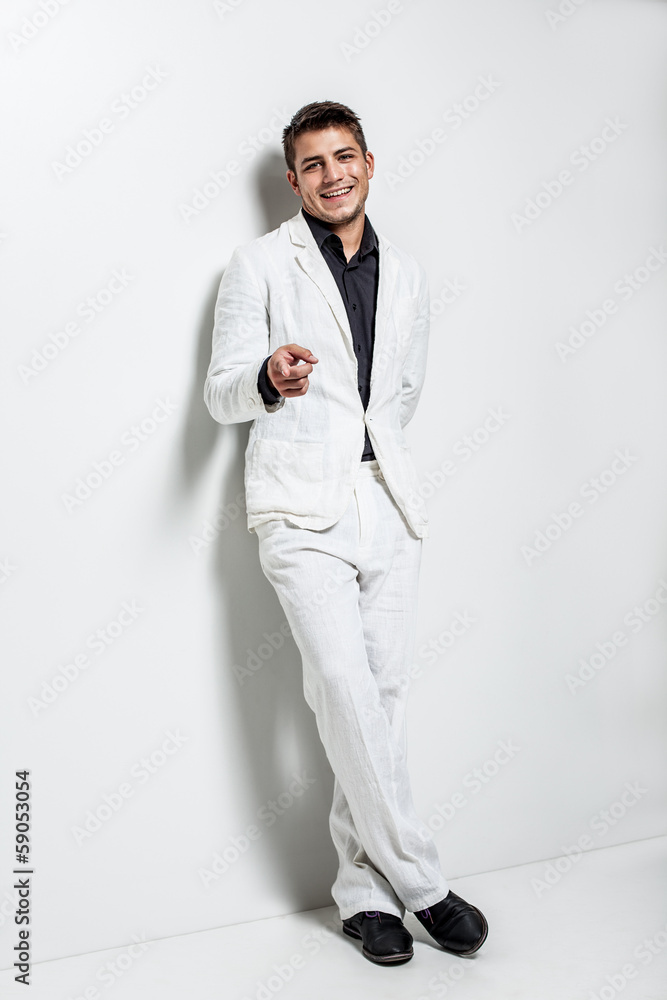 young man wearing white suit