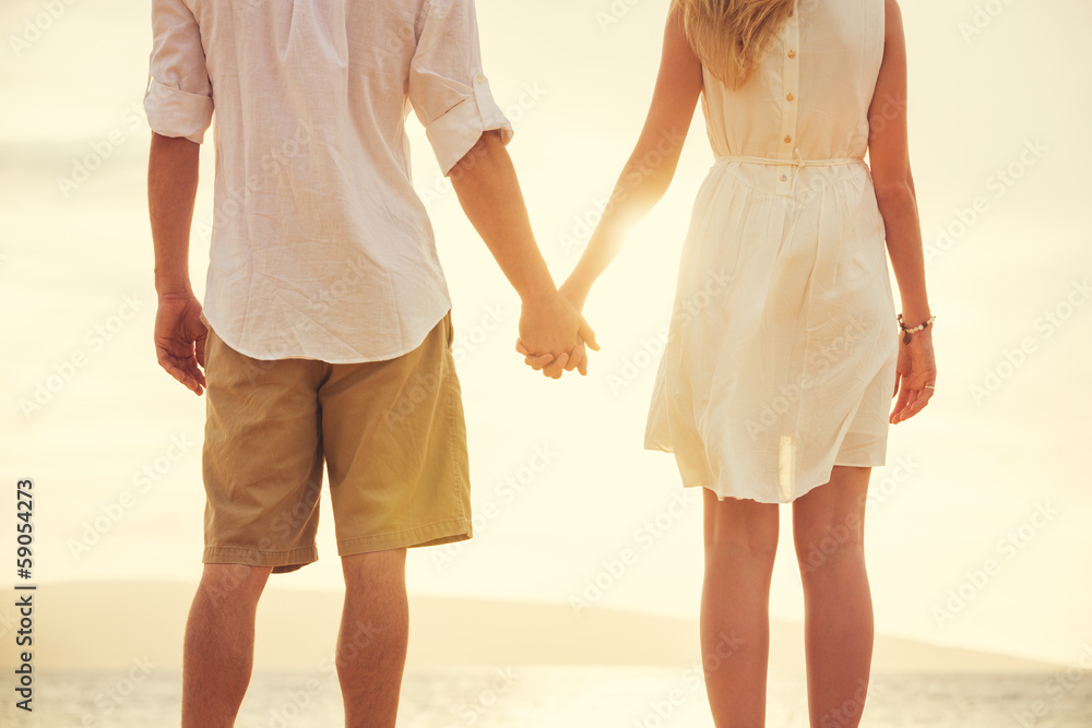 Young couple in love on the beach sunset Young couple in love on the beach sunset