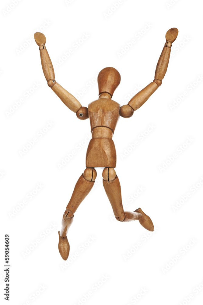 Happy wooden dummy in jump action isolated on white background Happy wooden dummy in jump action isolated on white background