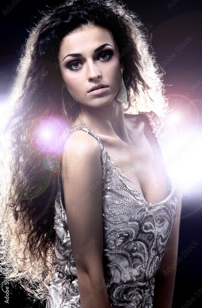 Young dancing woman, with flashes on background Young dancing woman, with flashes on background