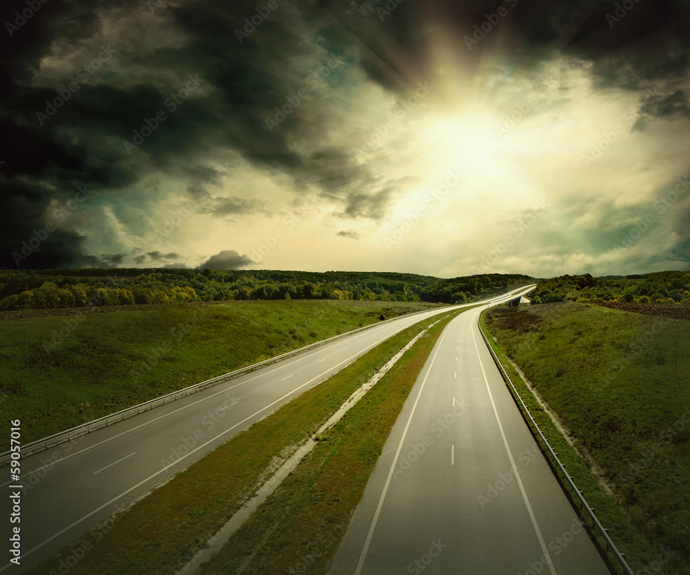 Beautiful view on the road under sky with clouds Beautiful view on the road under sky with clouds