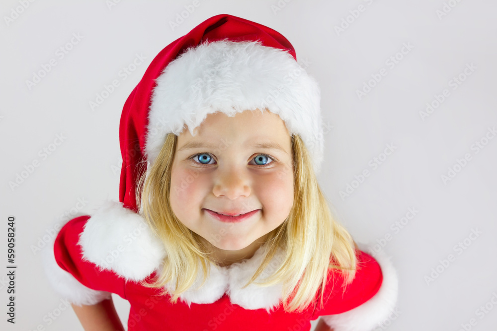 Portrait of a beautiful girl in a red new year cap