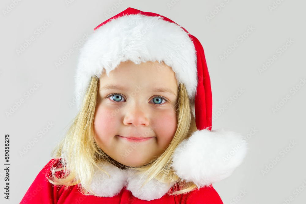 Portrait of a beautiful girl in a red new year cap Portrait of a beautiful girl in a red new year cap