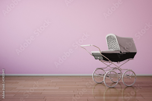 Baby stroller on pink wall horizontal photo
