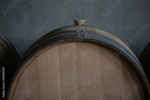 Tablou canvas Wine barrels stacked in the cellar of the winery