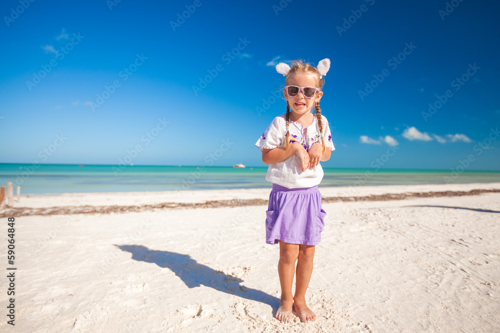 Adorable little girl in easter costume on the exotic beach Adorable little girl in easter costume on the exotic beach