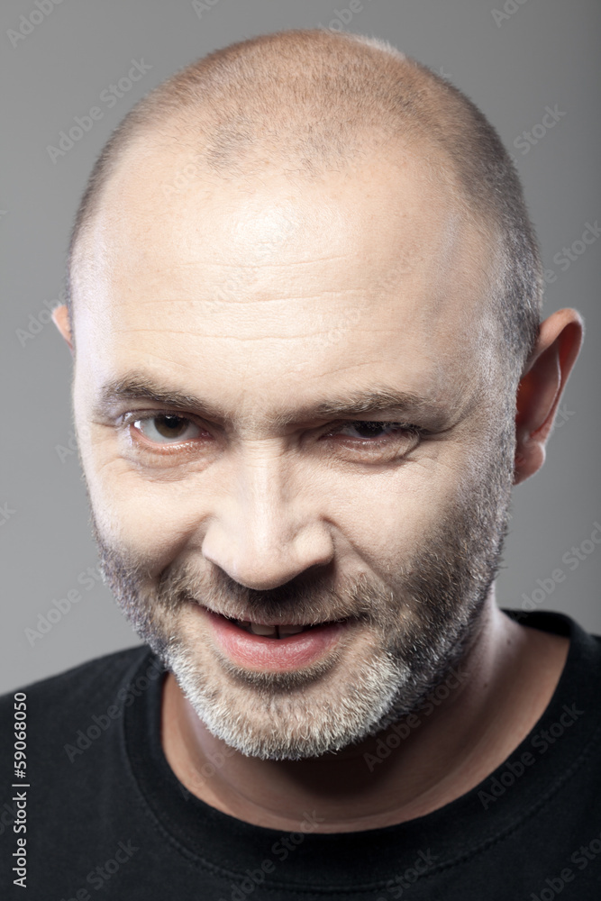 Obraz premium portrait of gloomy man isolated on gray background