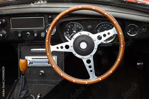 Photography Wooden steering wheel from a MGB roadster sports car