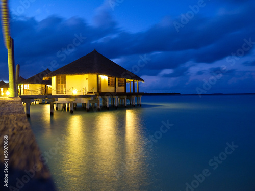 Overwater bungalows in tropical island