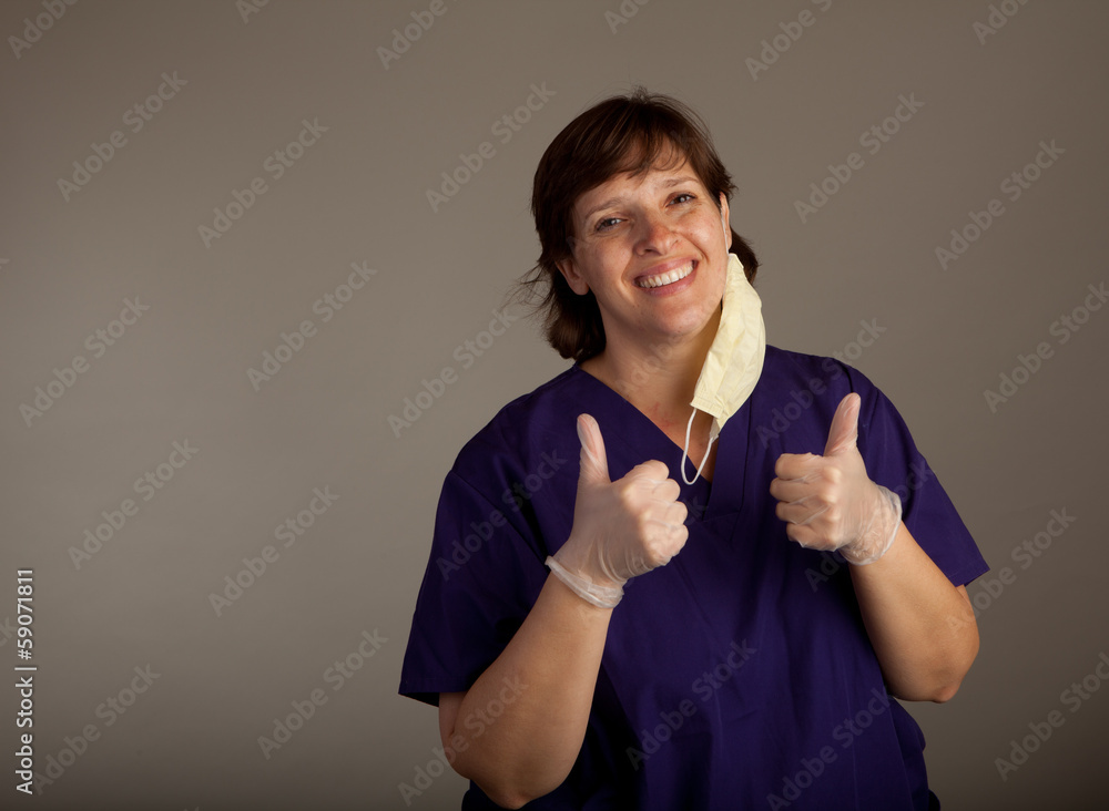 Positive Doctor or Nurse in mask giving thumbs up Positive Doctor or Nurse in mask giving thumbs up