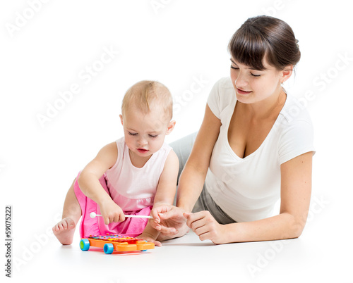 Mother and baby play musical toy isolated on white background