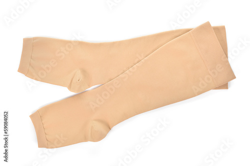 Medical compression stockings on white background.