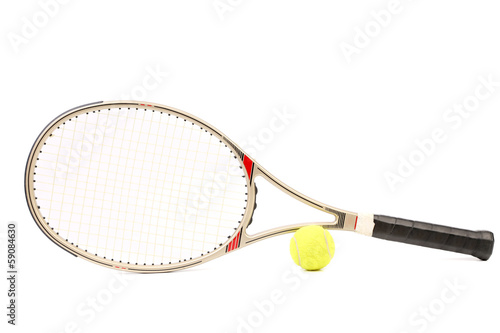 Gray tennis racket and yellow ball.