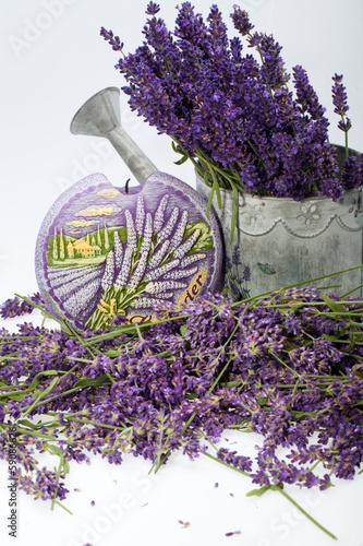 Fototapeta Naklejka Na Ścianę i Meble -  Watering Can, Candle and Lavender isolated on white