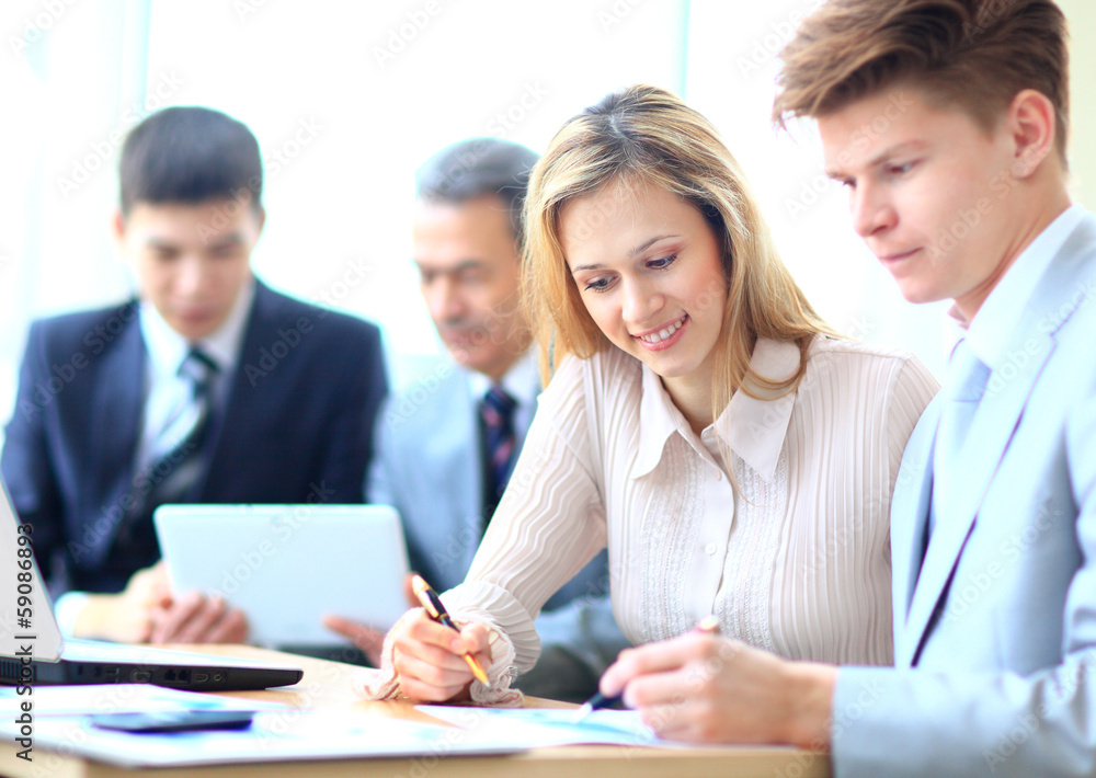 Business team working on their business project Business team working on their business project