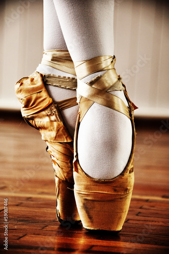Ballet dancer with old shoes