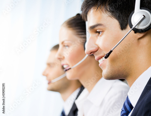 Three customer support phone operators photo