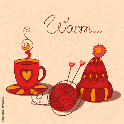 A cup of warm tea, wool and knitted cap