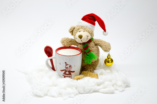 Christmas teddy bear with a cup of milk