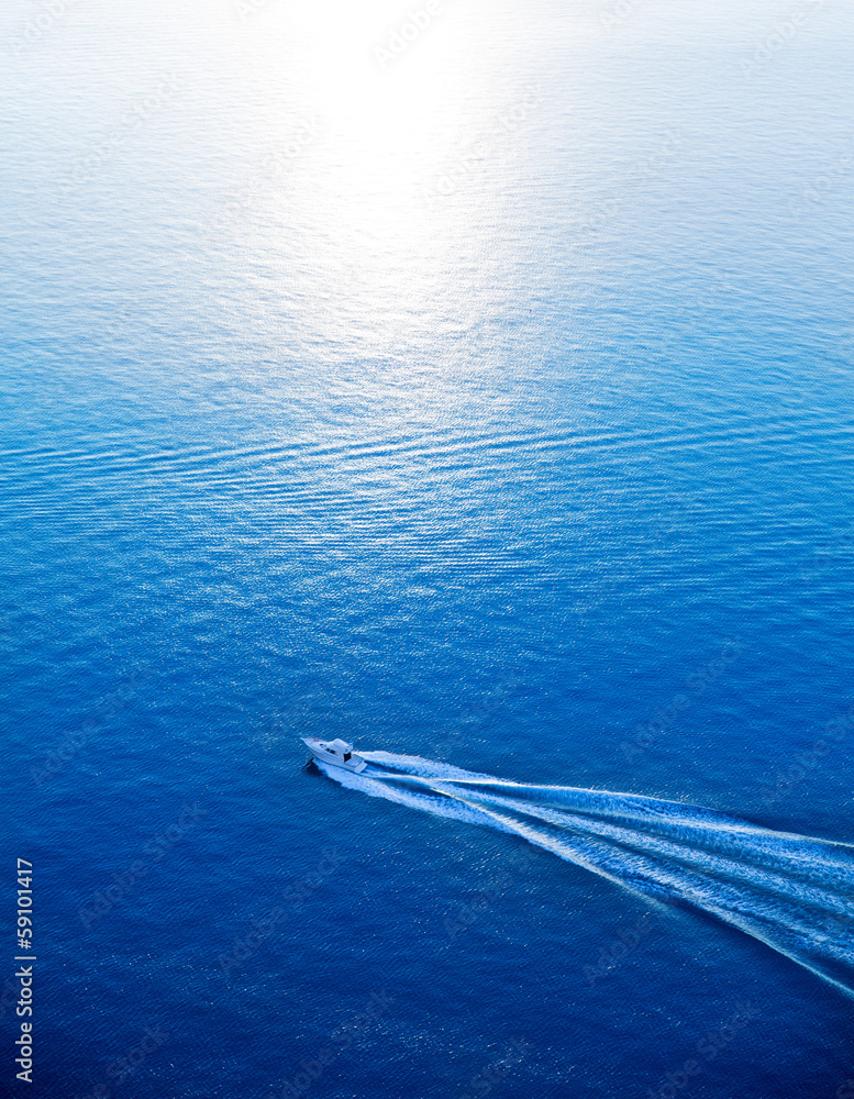 Naklejka premium Boat cruising blue Mediterranean sea aerial view