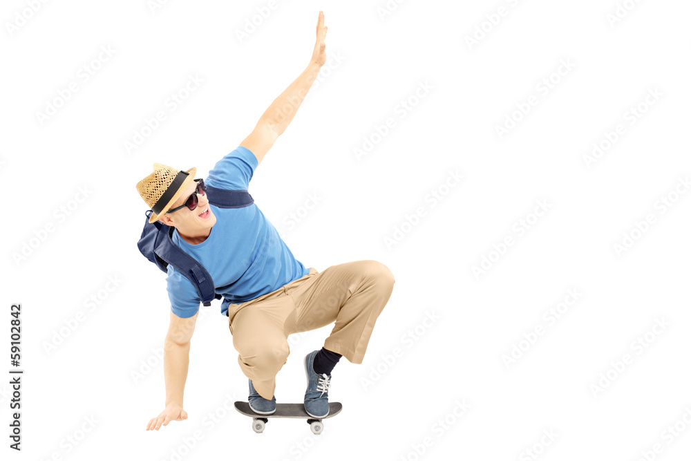 Excited male student with schoolbag skating on a skate board Excited male student with schoolbag skating on a skate board
