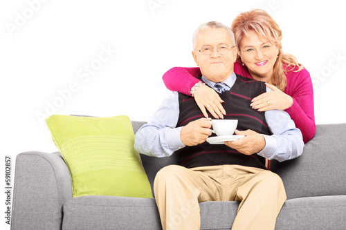 Middle aged couple posing during a coffee break