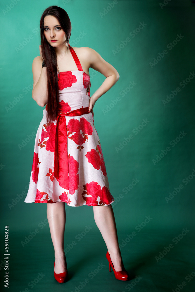 young woman in summer flowery dress on green young woman in summer flowery dress on green