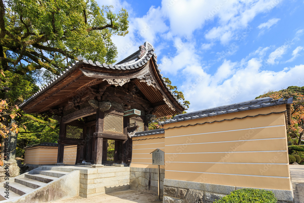 A small wood gate in front of Dazaifu Tenmangu A small wood gate in front of Dazaifu Tenmangu